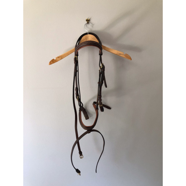Filet Norton marron taille cob. Bon état. Vendu avec ses rênes.