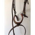 Filet Norton marron taille cob. Bon état. Vendu avec ses rênes.